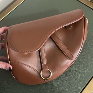 NWOT👜🐻 Dior’s ‘Sister From Another Mister’ Brown Faux Leather Saddle Bag 🐻👜